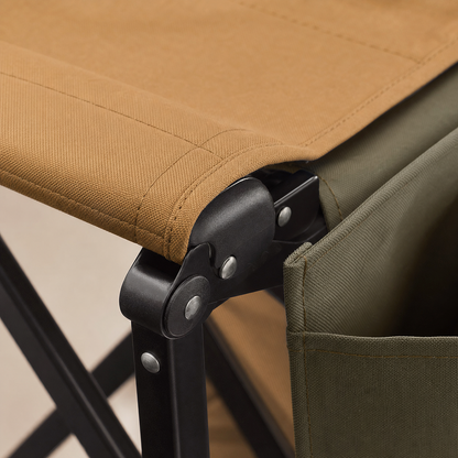 Close-up of padded seat fabric stitching and folding hinge